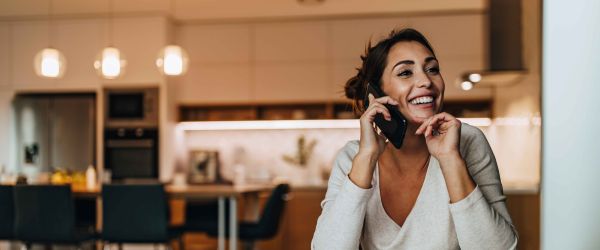 Woman smiling talking on the phone