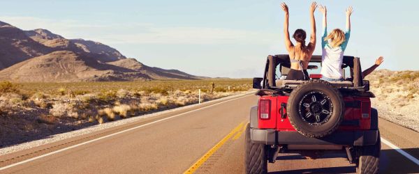 Two woman in a jeep with the top down