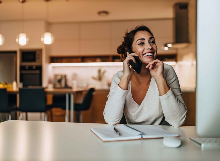 Woman smiling talking on the phone